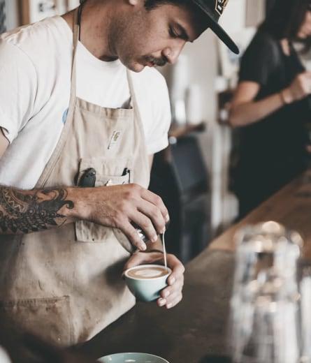 barista making a coffee